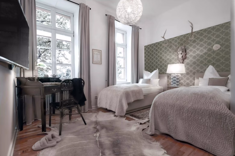 Bedroom with two twin beds and classic design.