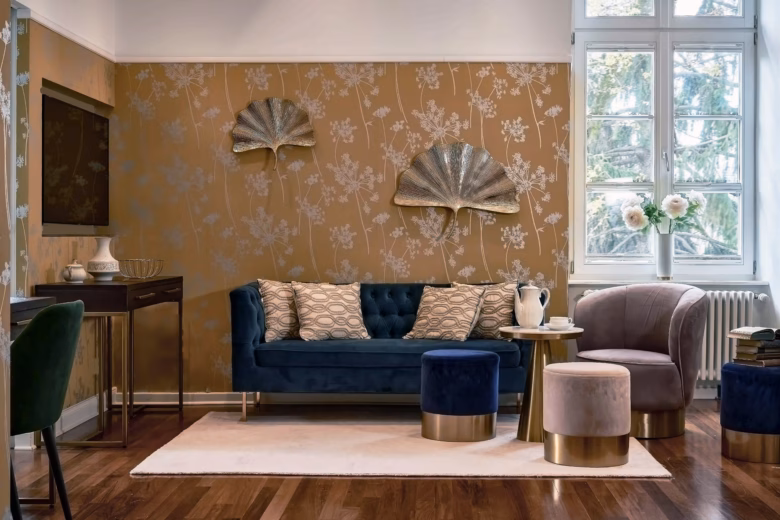 Elegant living area with velvet sofa and stylish seating in the two-bedroom Superior Residence.