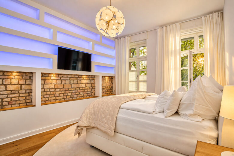 Bedroom in the Signature Two-Bedroom Residence Heidelberg with warm evening light