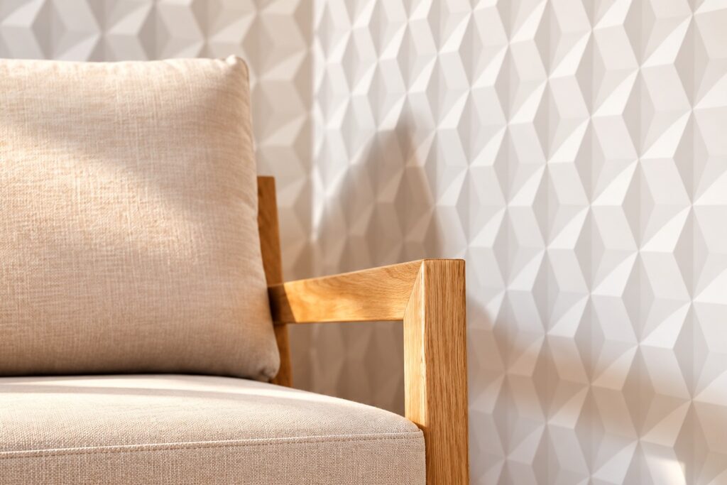 Interior design detail with oak armchair and geometric wall in the Two-Bedroom Companion Apartment Heidelberg