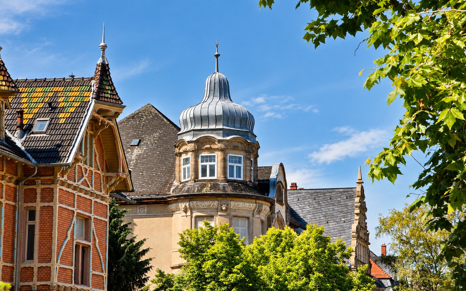 Historic villas with ornate turrets and colorful rooftops in Heidelberg Weststadt near Boutique Suites and Residences Heidelberg