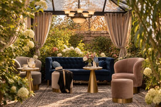 Garden lounge of the Superior Two-Bedroom Residence Heidelberg surrounded by lush greenery