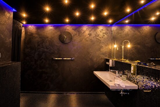 Private whirlpool bathroom in the One-Bedroom Residential Suite Heidelberg with atmospheric lighting