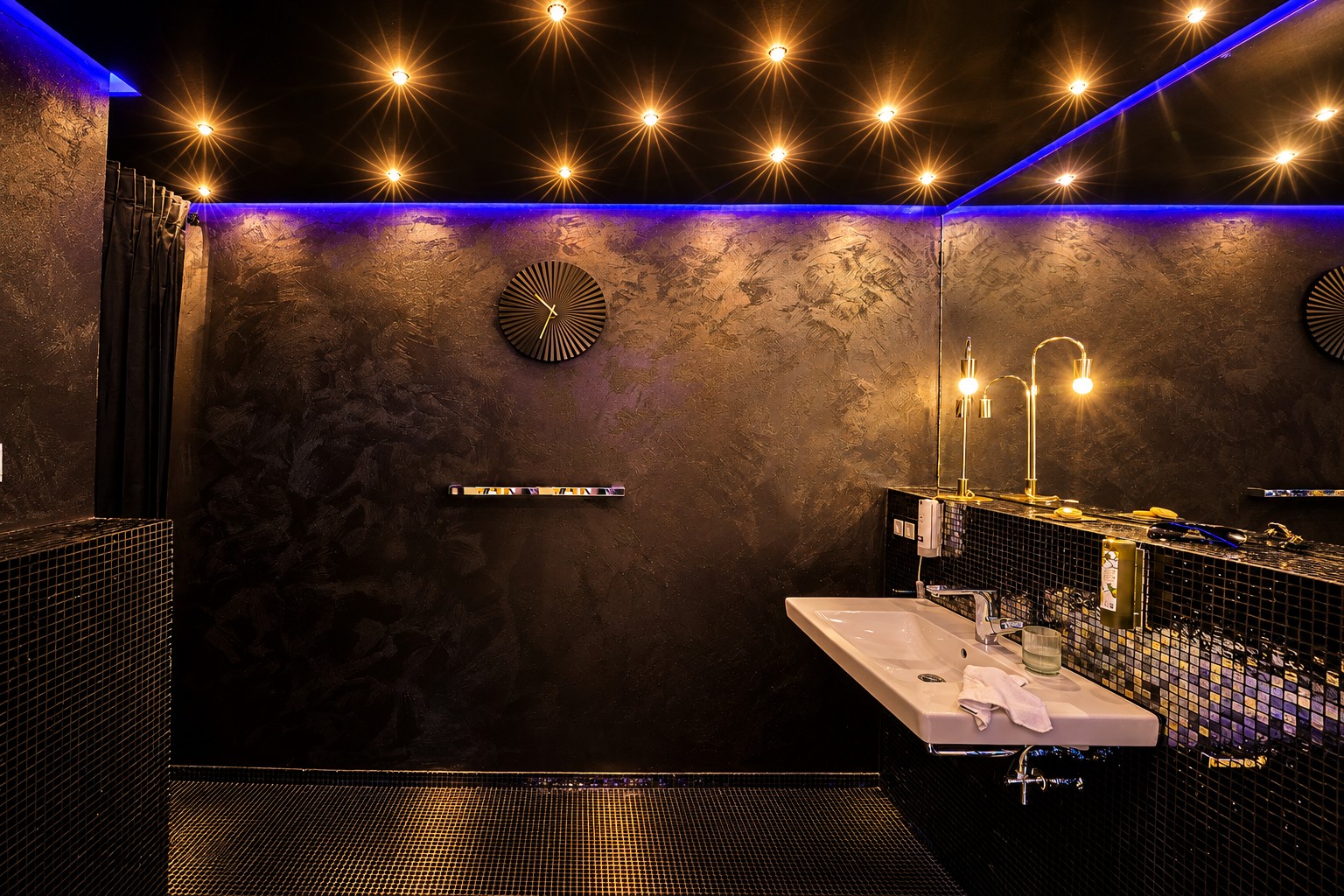 Private whirlpool bathroom in the One-Bedroom Residential Suite Heidelberg with atmospheric lighting