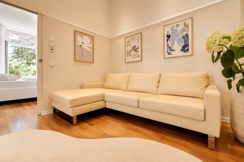 Elegant living area in the Imperial Two-Bedroom Suite Heidelberg with comfortable sofa and natural light