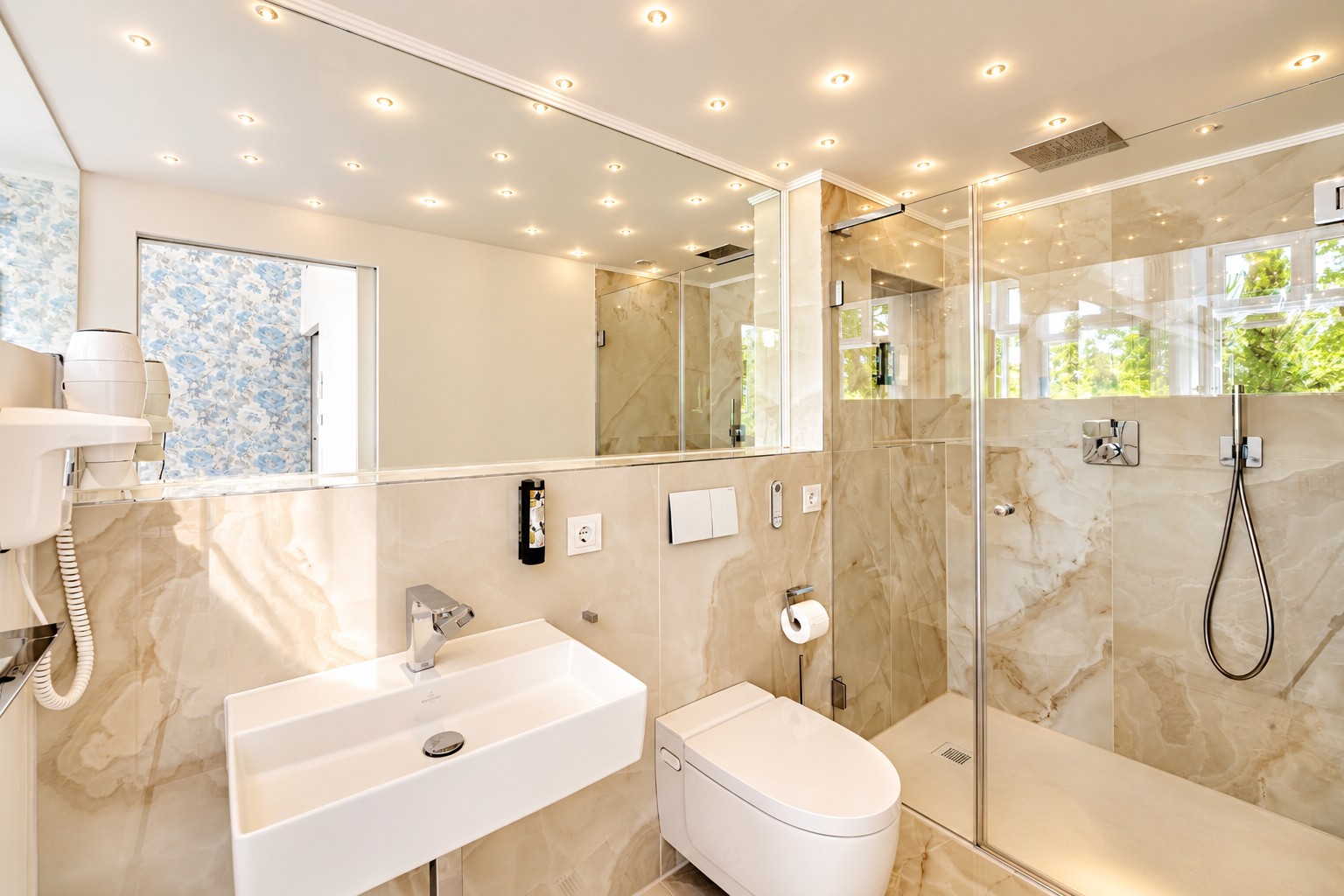 Bright bathroom with walk-in rain shower in the Imperial Two-Bedroom Suite Heidelberg