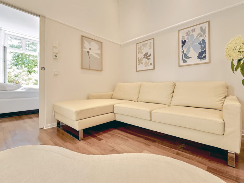Private living area of the Imperial Two-Bedroom Suite Heidelberg with sofa and adjoining bedroom