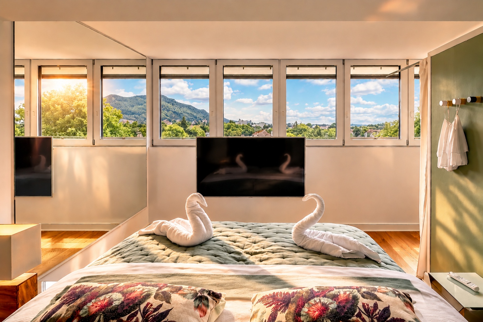 Bright bedroom in the Royal Three-Bedroom Penthouse Residence Heidelberg with panoramic windows, view and towel swans