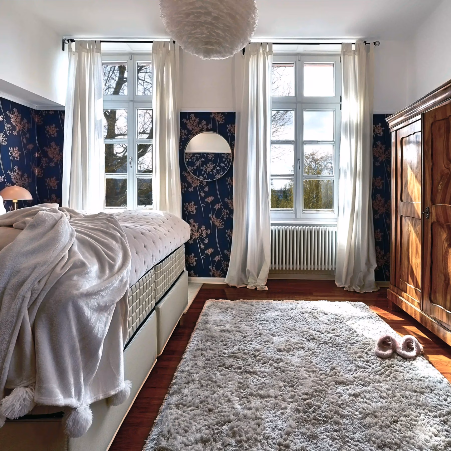 Cozy bedroom with king-size bed and vintage wardrobe in the two-bedroom Superior Residence.