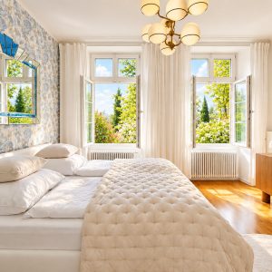 Bright bedroom in the Imperial Two-Bedroom Suite Heidelberg with fresh spring morning light